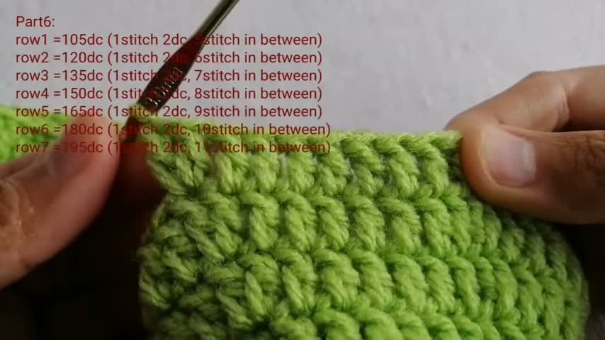 Crocheting the broad, dramatic brim rows expanding by 15 double crochets per round.